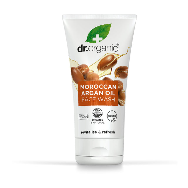Tube of face wash with branding "dr.organic" and "Moroccan Argan Oil." Features argan nuts and logos for vegan, organic, and recycled. Clean, refreshing design.
