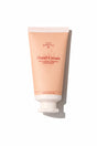 A peach-colored tube of Dublin Herbalists Hand Cream with Sweet Orange and Bergamot.