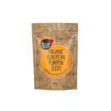 A 500g brown paper pouch of True Organic European Pumpkin Seeds with a large orange circular label and subtle seed illustrations.