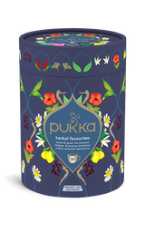 Pukka Organic "Herbal Favourites" tea selection box, a cylindrical navy blue container featuring a floral design and containing 30 herbal and green tea moments.