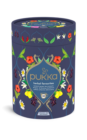 Pukka Organic "Herbal Favourites" tea selection box, a cylindrical navy blue container featuring a floral design and containing 30 herbal and green tea moments.