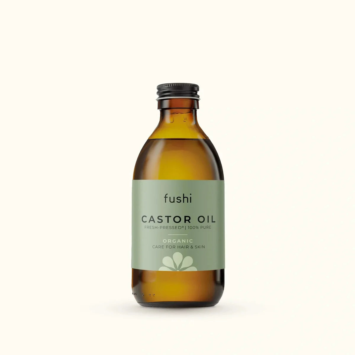 An amber glass bottle of Fushi Organic Fresh-Pressed 100% Pure Castor Oil.