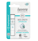 Lavera Basis Sensitiv organic lip balm, featuring a blend of organic jojoba oil and organic almond oil for intense moisture, packaged in 100% recycled material, and certified vegan.