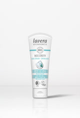 Minimalist studio shot of Lavera Basis Sensitiv organic hand cream.