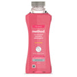 A 990ml bottle of Method concentrated laundry detergent in the Peony Blush scent, featuring a pink liquid formula and a label highlighting "33 washes" and that it "knocks out tough stains" and "revives colours.