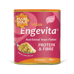 Marigold Engevita nutritional yeast flakes canister with protein & fibre on a solid black background.