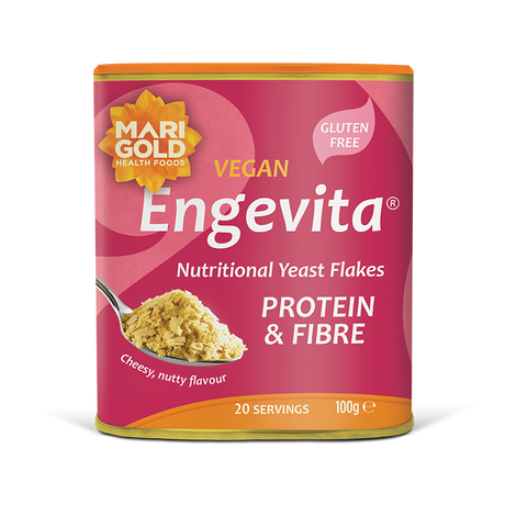 Marigold Engevita nutritional yeast flakes canister with protein & fibre on a solid black background.