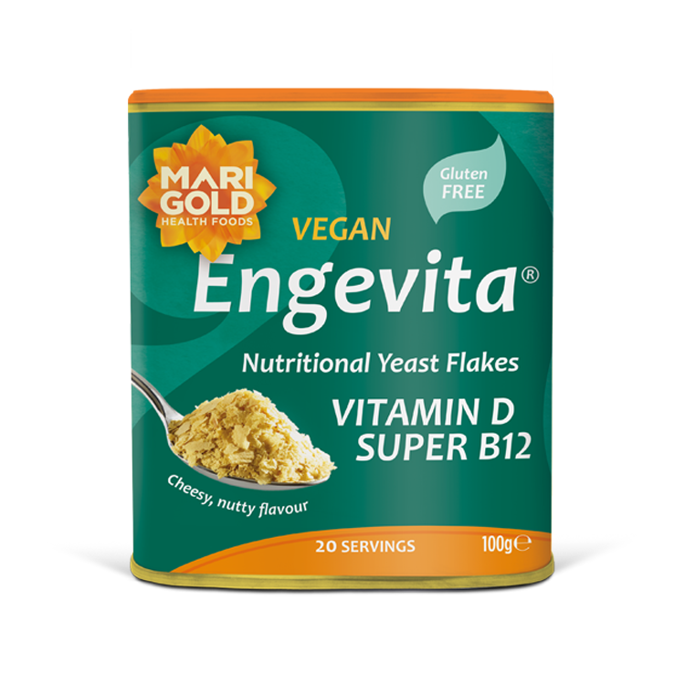 Marigold Engevita nutritional yeast flakes canister with a spoonful of flakes.