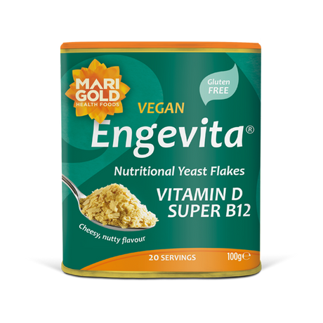 Marigold Engevita nutritional yeast flakes canister with a spoonful of flakes.