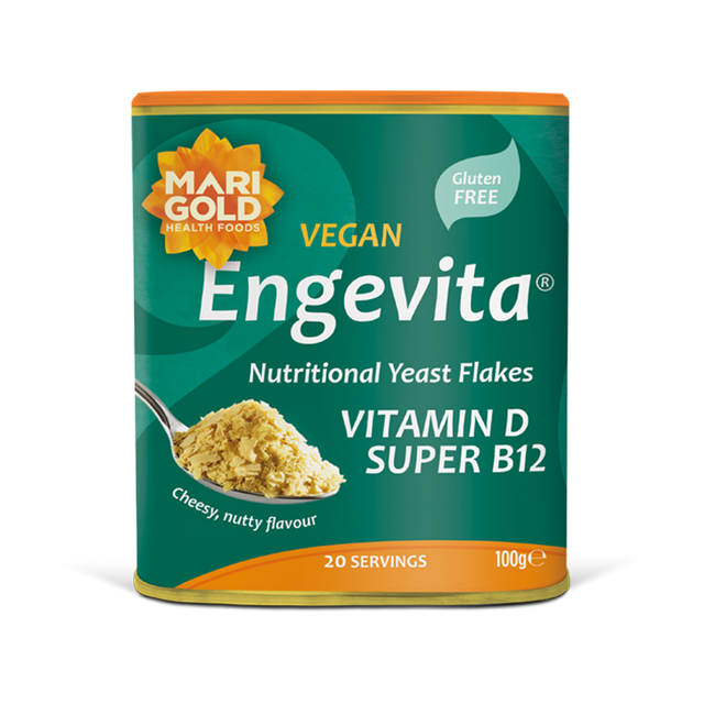 Marigold Engevita nutritional yeast flakes canister with a spoonful of flakes.