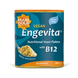Marigold Engevita nutritional yeast flakes canister with B12 on a solid black background.