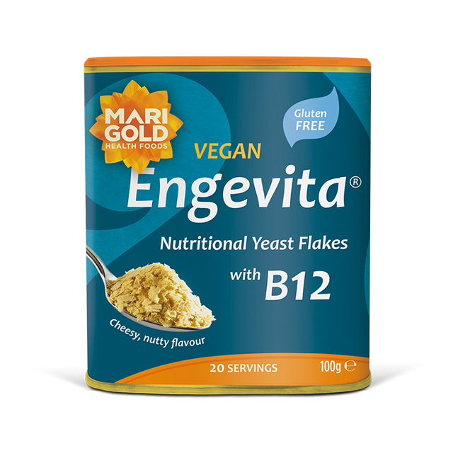 Marigold Engevita nutritional yeast flakes canister with B12 on a solid black background.
