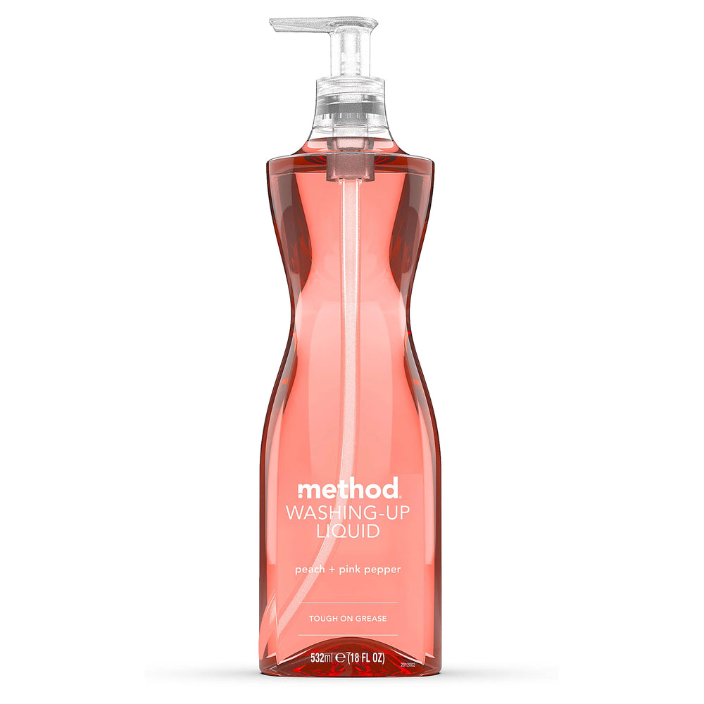 Method peach and pink pepper washing-up liquid in a transparent pump bottle on white background.