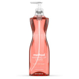 Method peach and pink pepper washing-up liquid in a transparent pump bottle on white background.