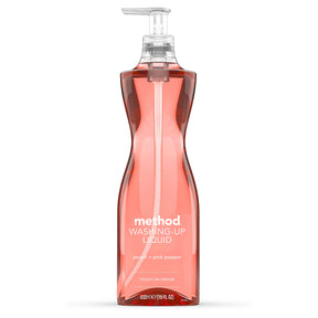 Method peach and pink pepper washing-up liquid in a transparent pump bottle on white background.