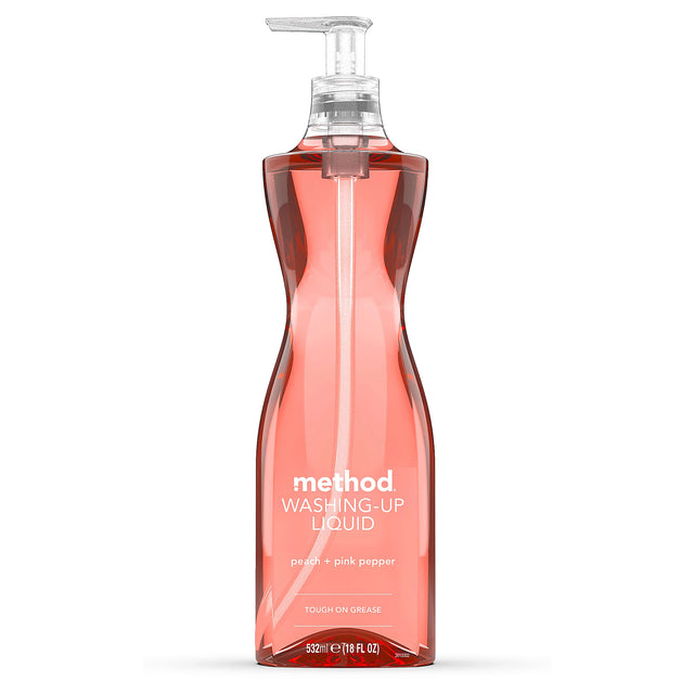 Method peach and pink pepper washing-up liquid in a transparent pump bottle on white background.