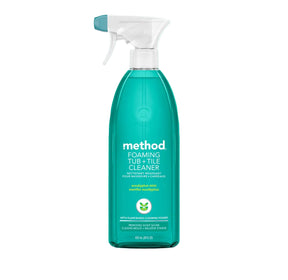 A bottle of Method Foaming Tub + Tile Cleaner with a white spray top and teal liquid, centered on a teal-to-green gradient background.