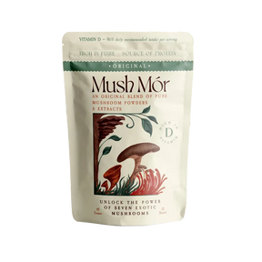 Mush Mór mushroom powder pouch on a pedestal with an abstract botanical wave background.