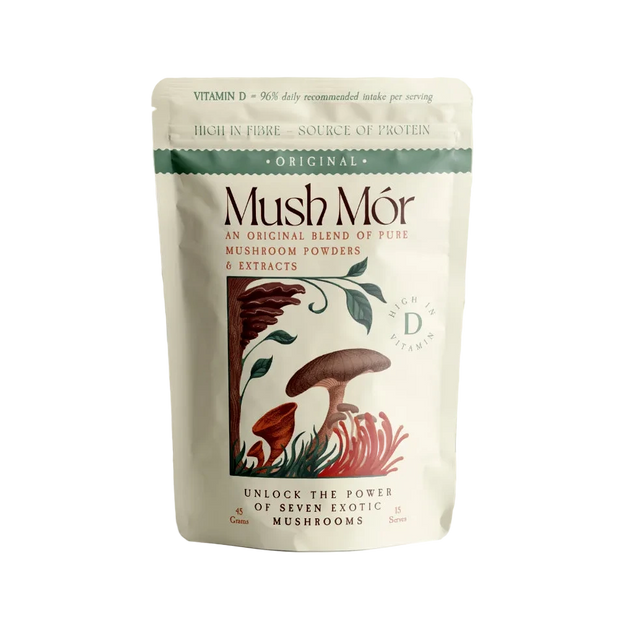 Mush Mór mushroom powder pouch on a pedestal with an abstract botanical wave background.
