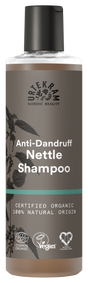 A tall bottle of Urtekram Anti-Dandruff Nettle Shampoo with a grey and brown label featuring a nettle leaf illustration. The bottle displays "Certified Organic" and "100% Natural Origin" labels alongside Vegan and Ecocert certifications.