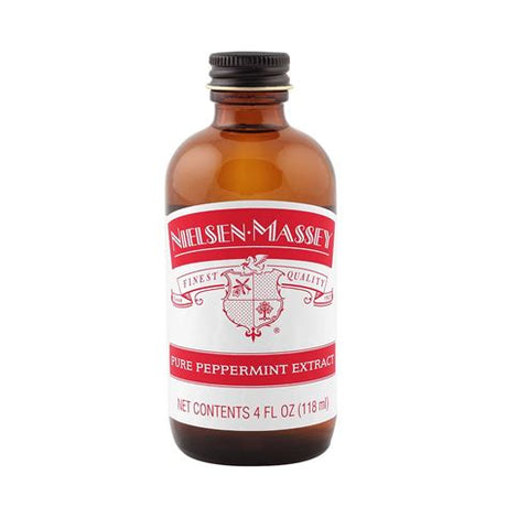 Bottle of Nielsen-Massey pure peppermint extract on a white background