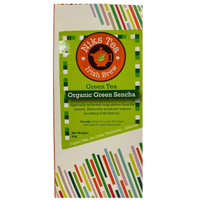 Niks Tea Organic Green Sencha loose leaf tea box with a green label and colorful abstract stripe patterns.