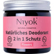Niyok natural deodorant jar in a "Flowers" scent with a pink label and silver screw cap.