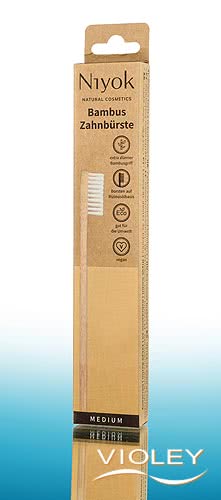 Niyok natural bamboo toothbrush in sustainable brown and yellow eco-friendly cardboard packaging.