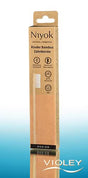 Niyok kids natural bamboo toothbrush in sustainable brown and peach cardboard packaging.