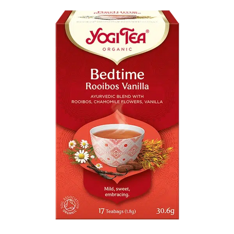 A red box of Yogi Tea Organic Bedtime Rooibos Vanilla featuring an Ayurvedic blend with chamomile flowers and vanilla beans on a white background.