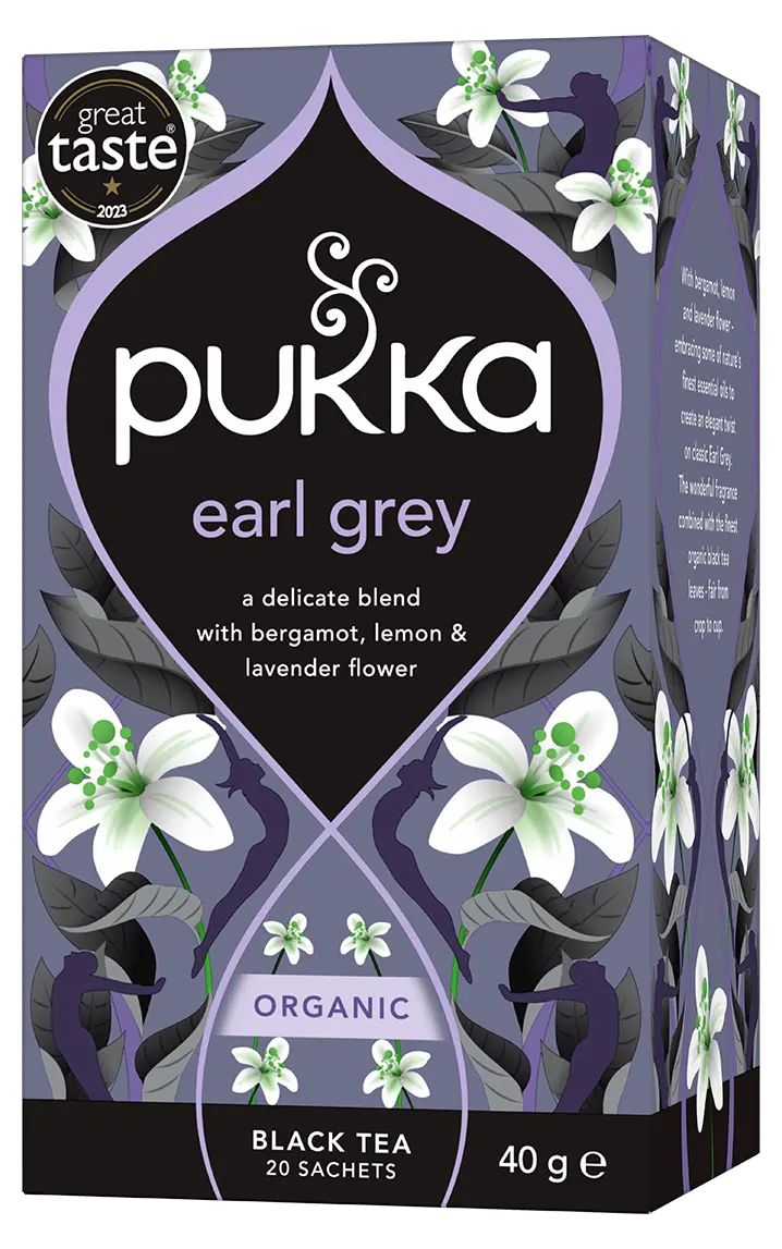 A purple box of Pukka Organic Earl Grey black tea, featuring a delicate blend with bergamot, lemon, and lavender flower containing 20 sachets.