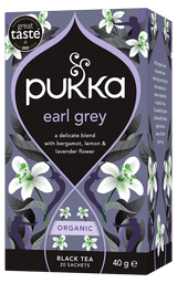 A purple box of Pukka Organic Earl Grey black tea, featuring a delicate blend with bergamot, lemon, and lavender flower containing 20 sachets.