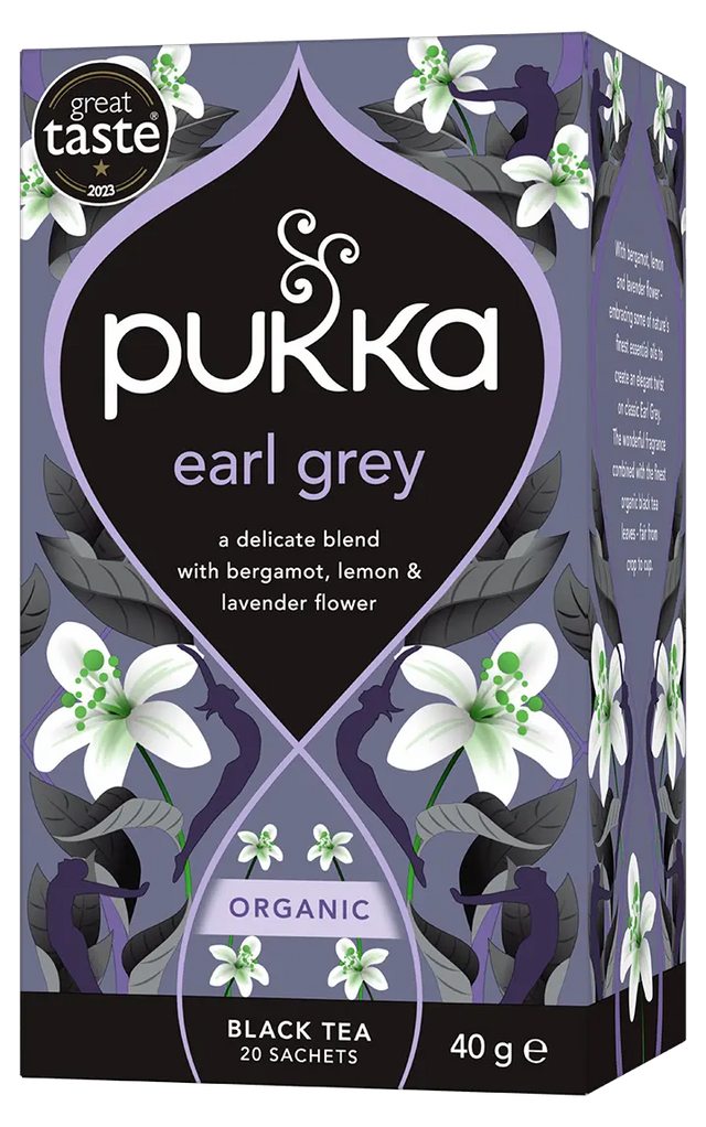 A purple box of Pukka Organic Earl Grey black tea, featuring a delicate blend with bergamot, lemon, and lavender flower containing 20 sachets.
