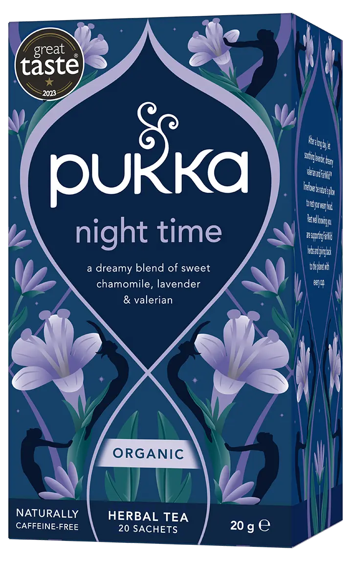 A dark blue box of Pukka Organic Night Time herbal tea, featuring a dreamy caffeine-free blend of oatflower, lavender, and limeflower containing 20 sachets.