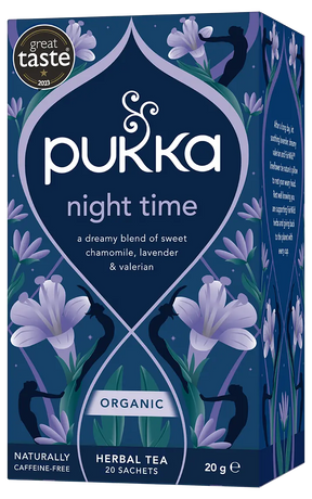 A dark blue box of Pukka Organic Night Time herbal tea, featuring a dreamy caffeine-free blend of oatflower, lavender, and limeflower containing 20 sachets.