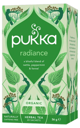 A light green box of Pukka Organic Radiance herbal tea, featuring a caffeine-free, blissful blend of nettle, peppermint, and fennel containing 20 sachets.