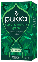 A dark green box of Pukka Organic Supreme Matcha Green tea, featuring a smooth blend of green tea and emerald matcha powder containing 20 sachets.