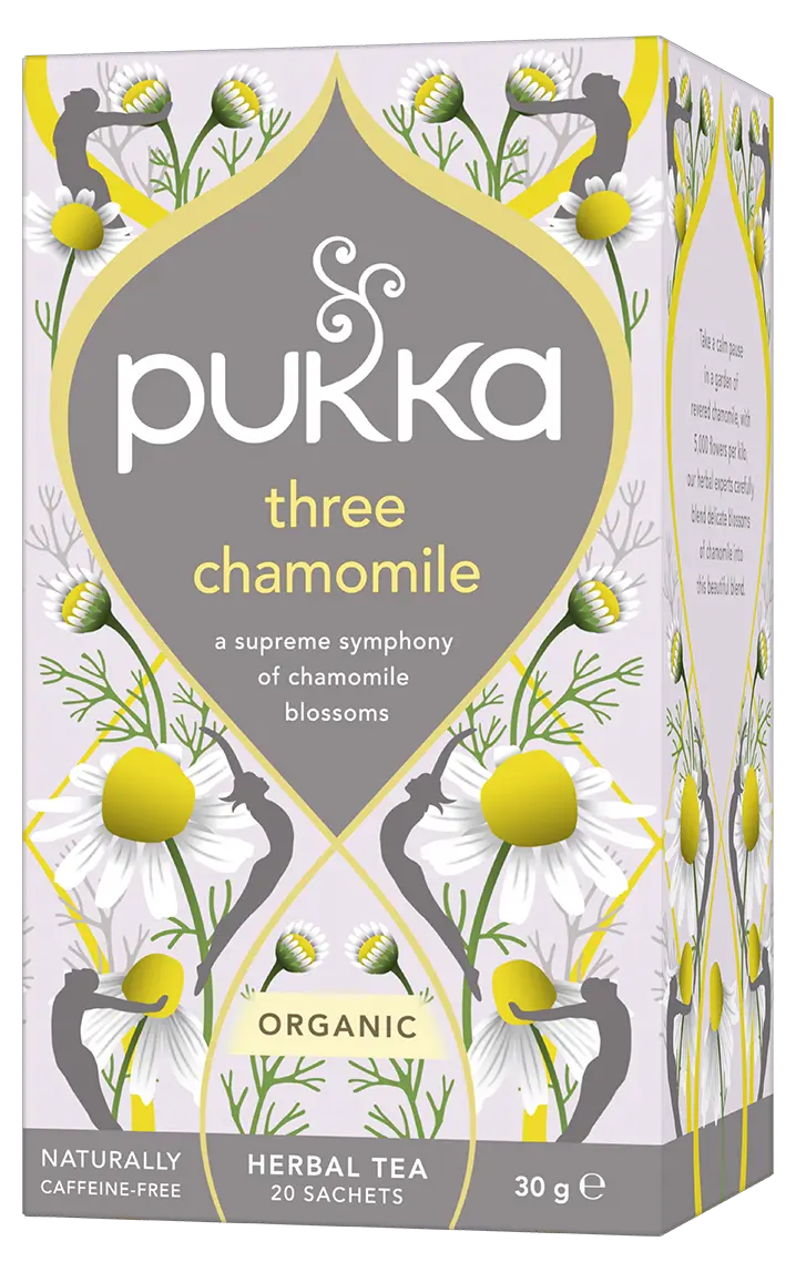 A light purple box of Pukka Organic Three Chamomile herbal tea, featuring a caffeine-free blend of chamomile blossoms containing 20 sachets.