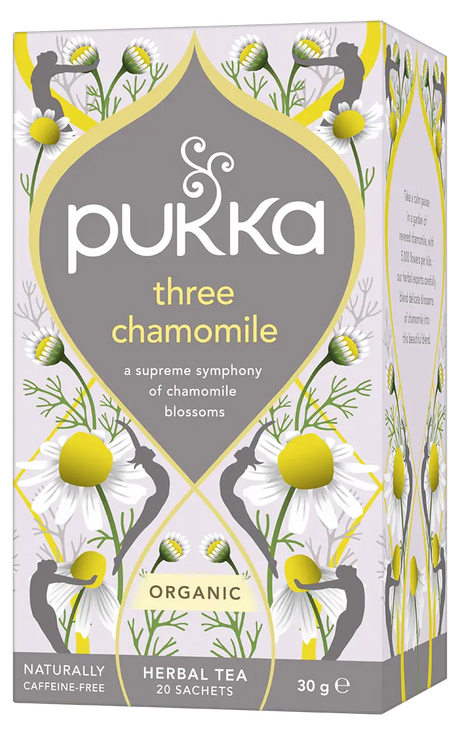 A light purple box of Pukka Organic Three Chamomile herbal tea, featuring a caffeine-free blend of chamomile blossoms containing 20 sachets.