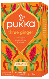 An orange box of Pukka Organic Three Ginger herbal tea, featuring a warming caffeine-free blend of ginger, galangal, and turmeric containing 20 sachets.