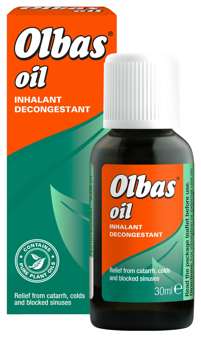Olbas Oil inhalant decongestant bottle and box featuring a leaf motif on an orange and green background.