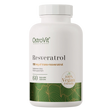 A white bottle of OstroVit Resveratrol dietary supplement capsules, featuring a white cap and a label with green and gold accents, set against a plain white background.