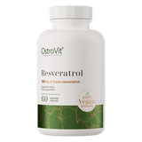 A white bottle of OstroVit Resveratrol dietary supplement capsules, featuring a white cap and a label with green and gold accents, set against a plain white background.