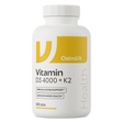A white bottle of OstroVit Vitamin D3 4000 + K2 dietary supplements, containing 100 tabs, shown on a clean white background.
