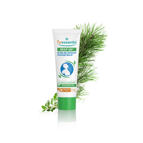 Puressentiel Resp OK Massage Balm tube featuring a chest and throat illustration, set against a dark checkered background with pine and herb branches.