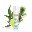 Puressentiel purifying air spray bottle surrounded by eucalyptus leaves, lime, and pine.