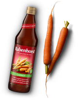 A bottle of Rabenhorst 100% organic carrot juice with two fresh carrots.