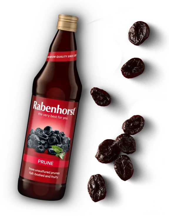 Glass bottle of Rabenhorst Prune juice with a red label, accompanied by scattered dried prunes.