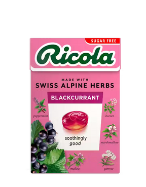 Pink sugar-free Ricola Blackcurrant herb drops box with botanical illustrations.