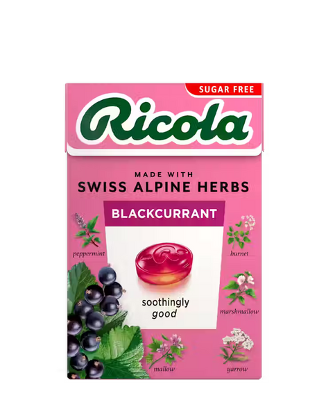 Pink sugar-free Ricola Blackcurrant herb drops box with botanical illustrations.